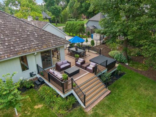 Designed for enjoying the outdoors, the new Trex deck offers room to dine, gather and relax, with the hot tub ready for unwinding at the end of the day.
