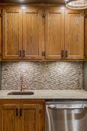 Full bar including a dishwasher makes entertaining a breeze