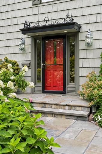 Front door surrounded by Lush Landscaping