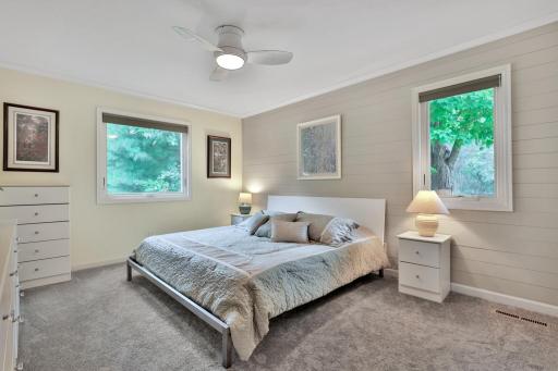 Primary Bedroom with Lake Views - Shiplap Walls - Ceiling Fan - Large Closet