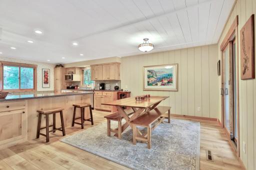 Dining Area with sliding glass door to cozy custom screened porch