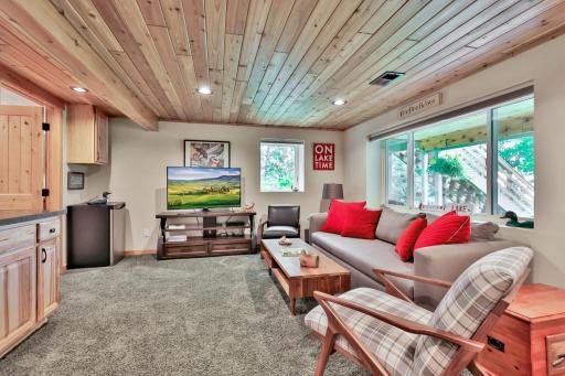 Family Room in Lower Level - Walk Out to Covered Patio, Back Yard, Gazebo and Lakeside