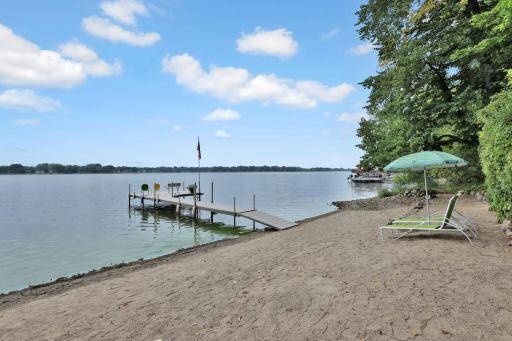 Wonderful sandy beach with solid hard lake bottom - Beach King Dock with generous triple sized platform dock decking which includes a cupholder bench, flag pole and TWO ladders