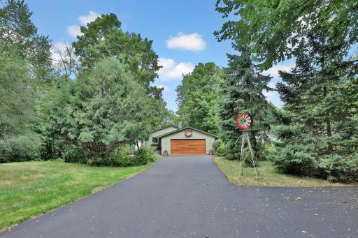 Welcome to 29166 Glader Boulevard....tucked away off the road on South Center Lake.