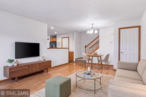 Dining Area in livingroom with storage under the stairs