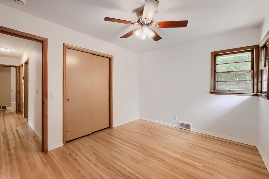 Primary bedroom with ceiling fan