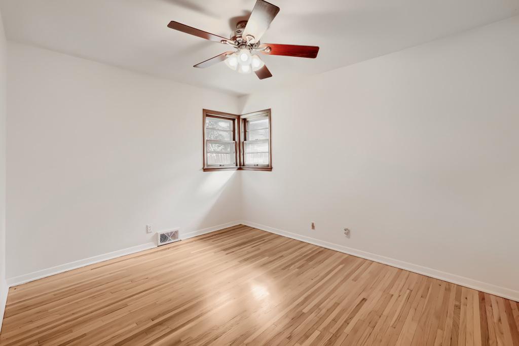 Home has 3 bedrooms on one level, all with wood floors.