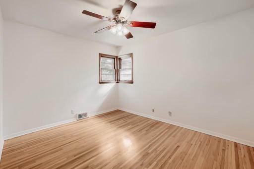 Home has 3 bedrooms on one level, all with wood floors.