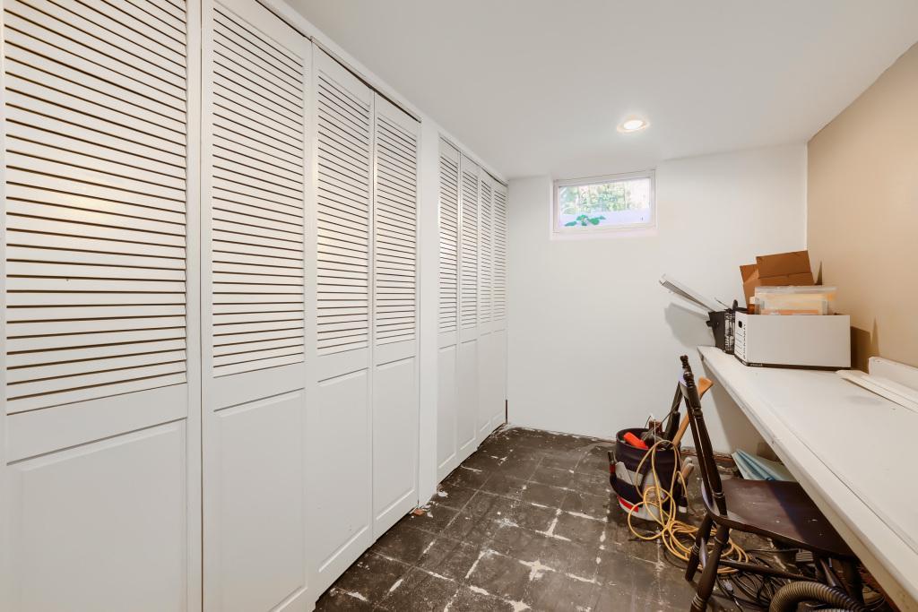 Lots of potential in this space - counter would make a great homework or craft station, needs new flooring. Abundant storage in the lower level.