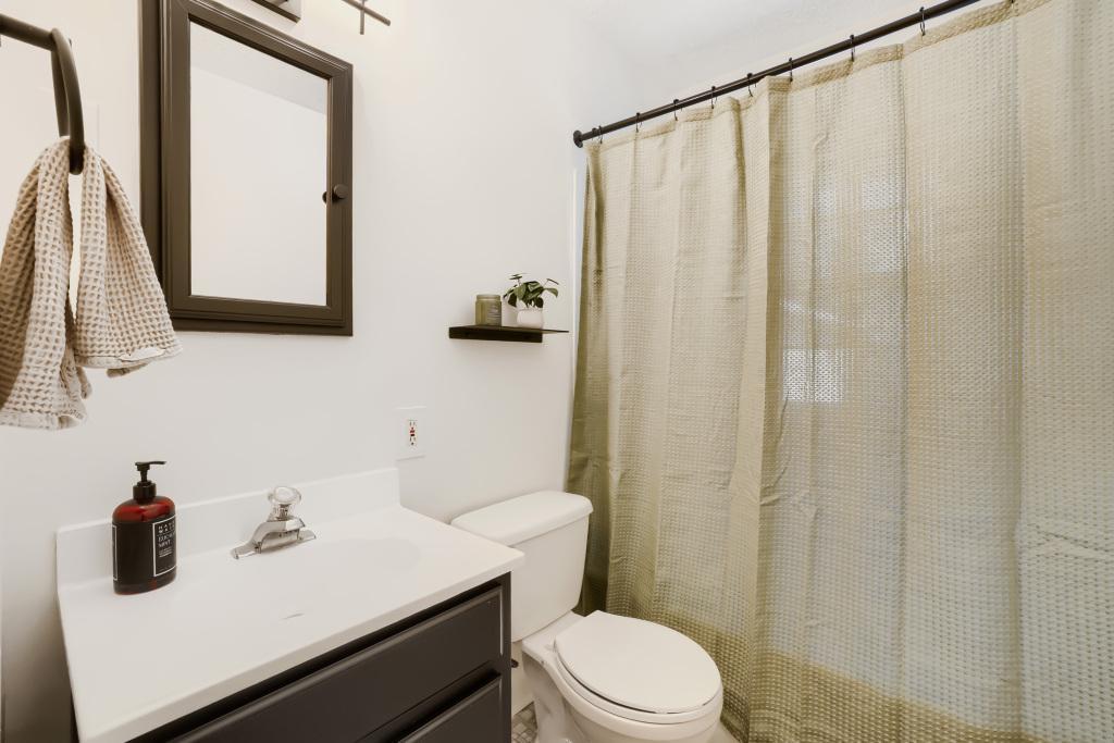 Bathroom with tub, shower and linen closet