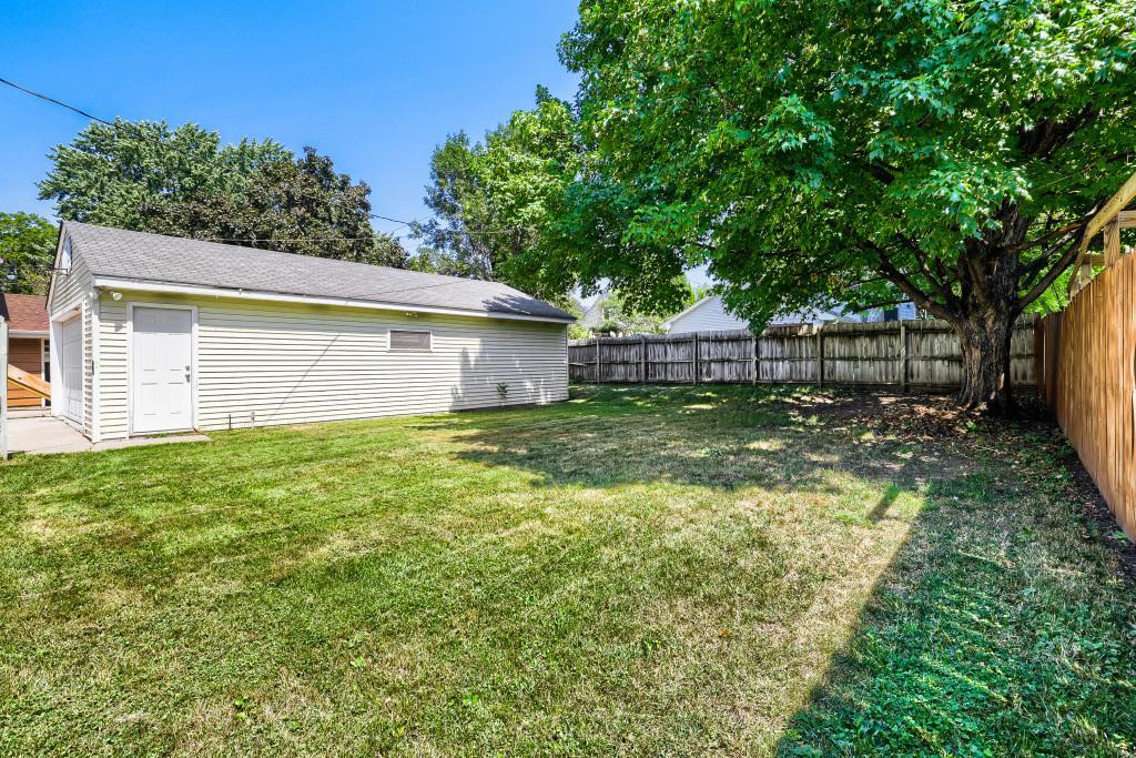 Nice fenced yard and view of 4 car garage. Yard feels very private with lots of room to relax, garden, let the dog roam or kids play if needed.