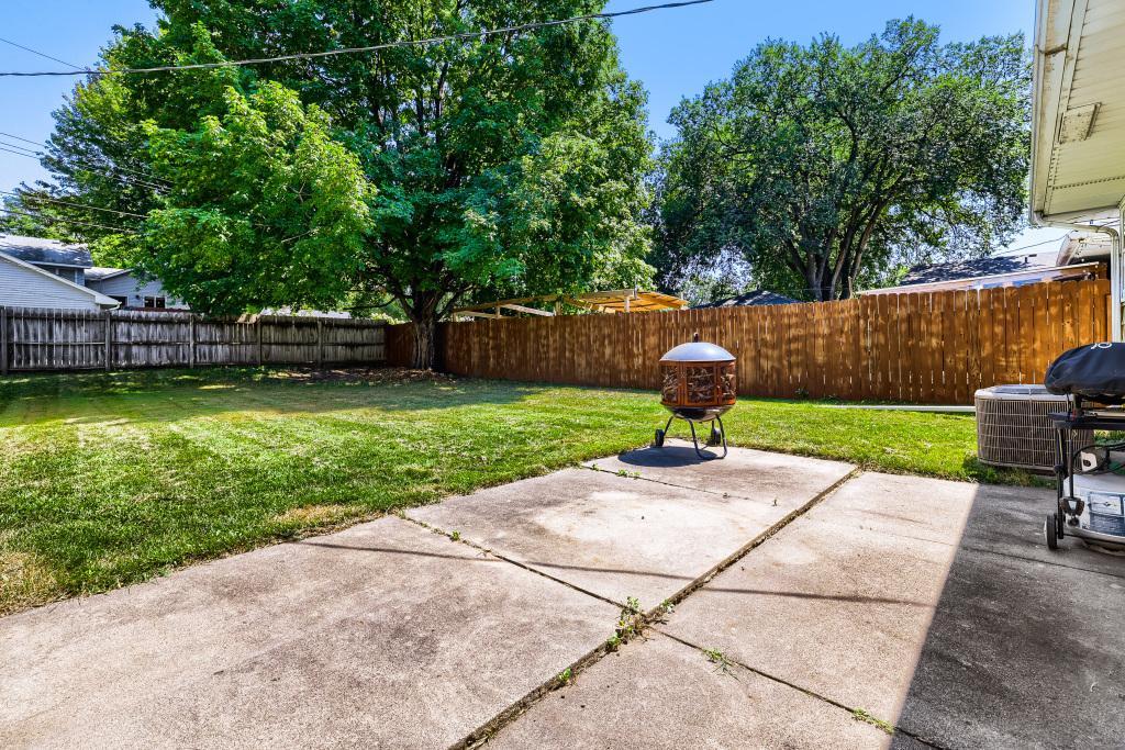 Nice back patio is perfect for a outdoor table or firepit. Private feeling and mature trees make this a great spot to hang out.