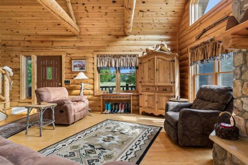 Vaulted ceilings and a wall of windows engulf the home in natural light