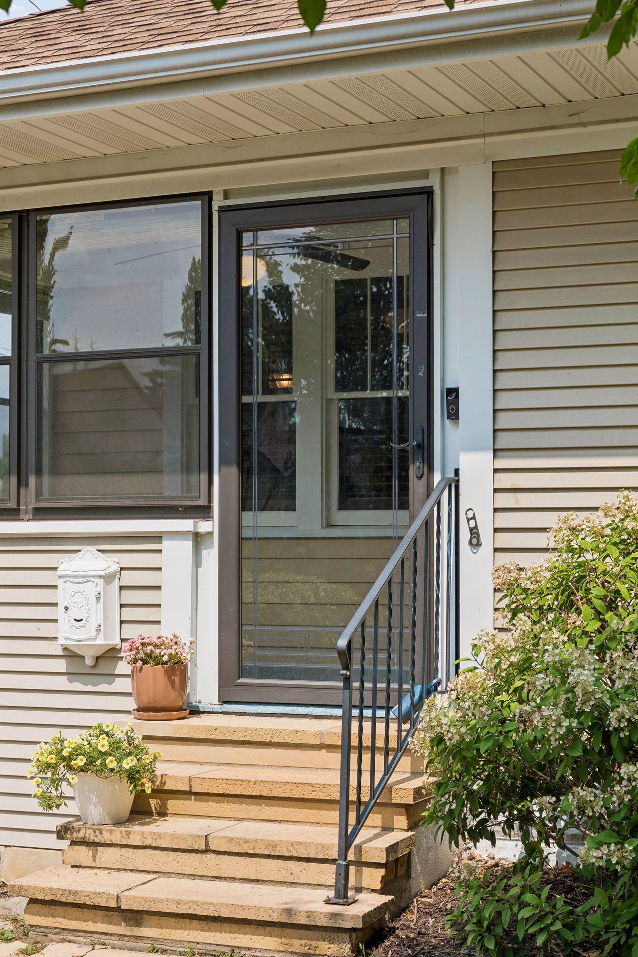 Note the beautiful stone steps and full view Pella glass door.