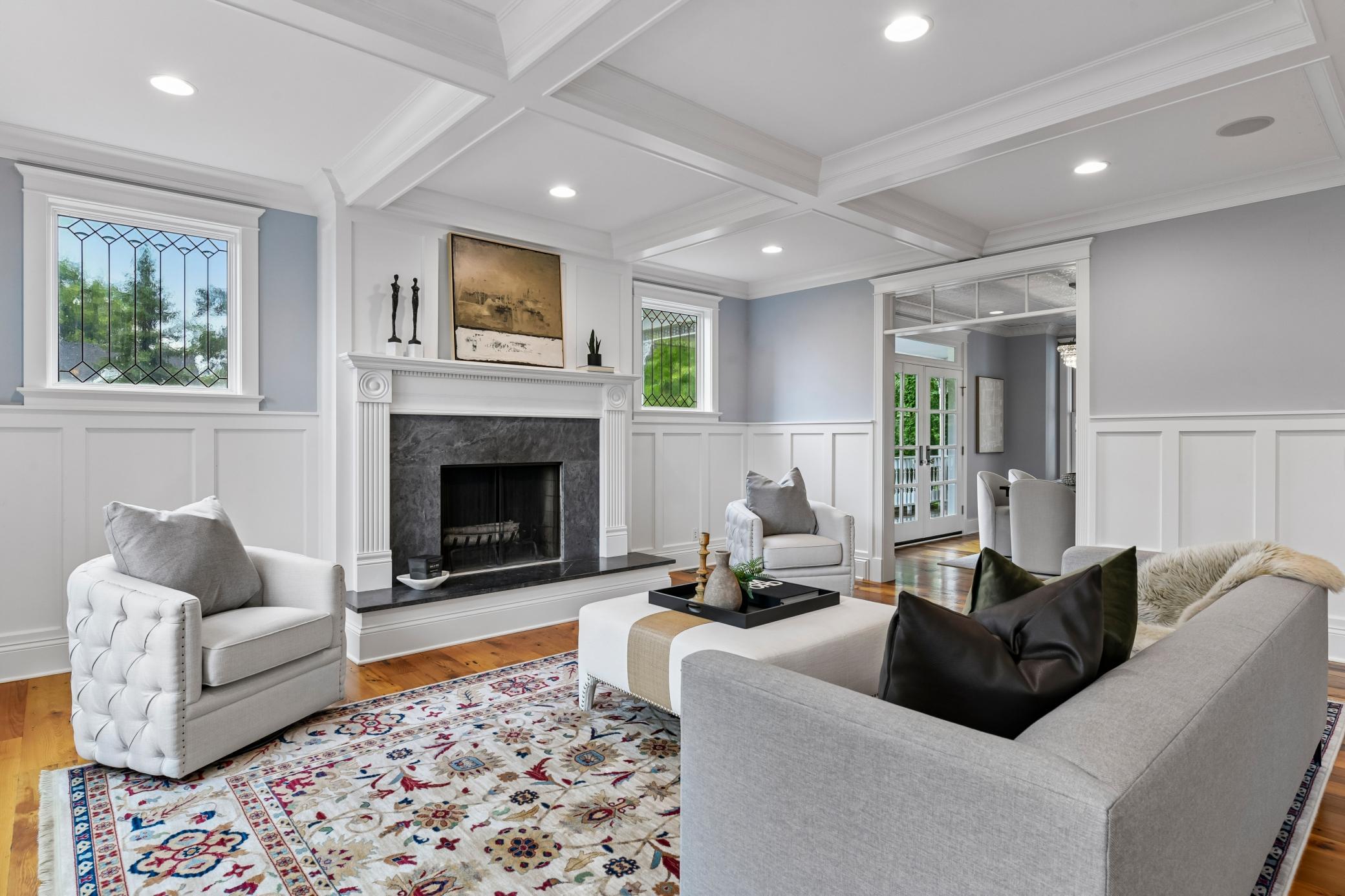 Living room with coffered ceiling and gas fireplace