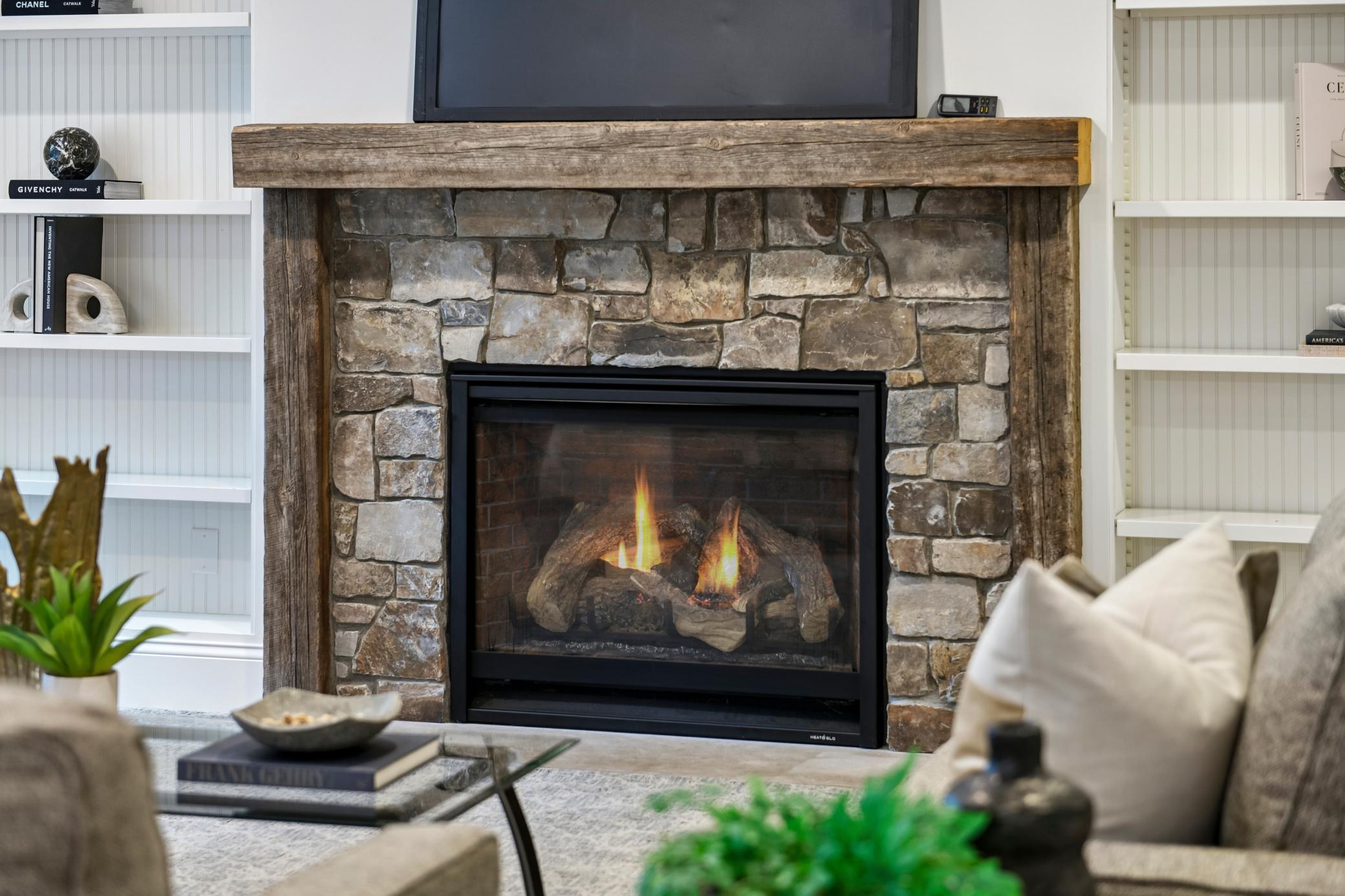 Family room with stone surround gas fireplace