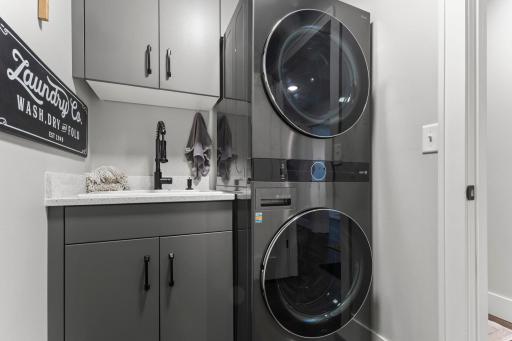 The laundry and mechanical room are joined together located next to the guest bath near the 3 additional bedrooms