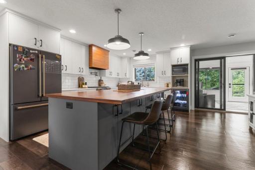 From the beverage fridge, drawer organizers, pot filler, matte black cafe appliances, water filtration system, custom vent hood & quartz counter tops this kitchen has it all.