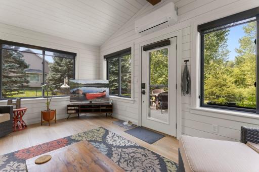 The sunroom also leads to the concrete patio and fenced-in backyard