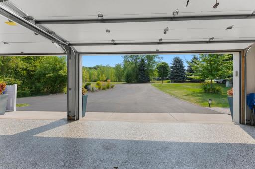 The garage leads to the asphalt drive and well manicured yard and landscaping