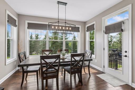 Large eating area off the kitchen with deck and backyard access