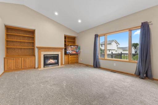 Comfortable living room with cozy fireplace and built-ins
