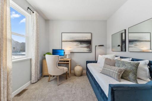 Main floor bedroom/office/flex room for your choosing. Jameson floor plan. Photo of previously built home; finishes, selections, colors, and floorplan to vary.