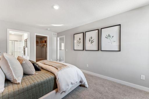 Bedroom #3 of 4 on upper level is a "Princess Suite" and has an attached HUGE walk in closet AND its own bathroom. Gorgeous! Jameson floor plan. Photo of previously built home; finishes, selections, colors, and floorplan to vary.