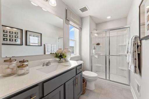 Bedroom #3 of 4 on upper level is a "Princess Suite" and has an attached HUGE walk in closet AND its own bathroom. Gorgeous! Jameson floor plan. Photo of previously built home; finishes, selections, colors, and floorplan to vary.