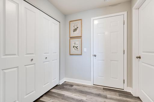 Large mudroom for everybody's year round Minnesota clothing. Previously built model home, finishes, selections, and colors to vary from future built home.