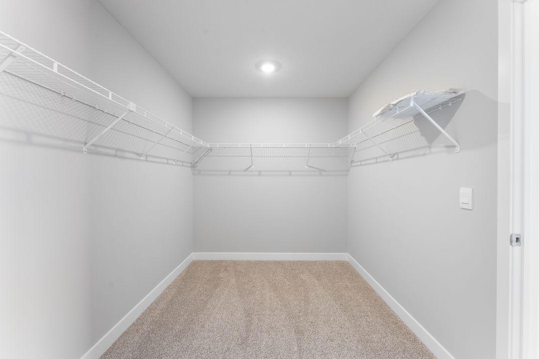 Enjoy the extra-large closet in the primary bedroom. Not actual home.