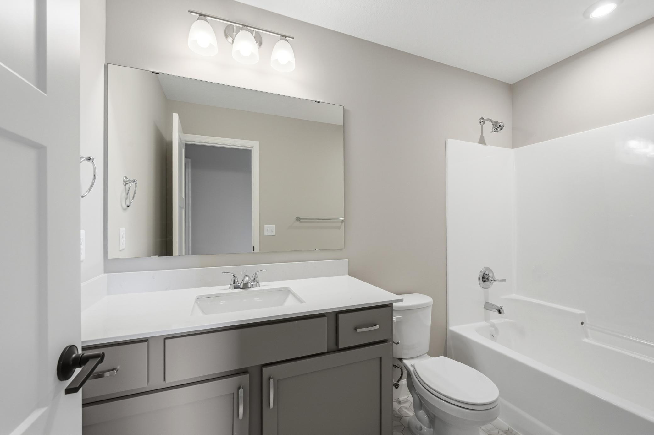 Upper level full bathroom - photos of a completed home of the same floorplan. Colors and selections may differ.