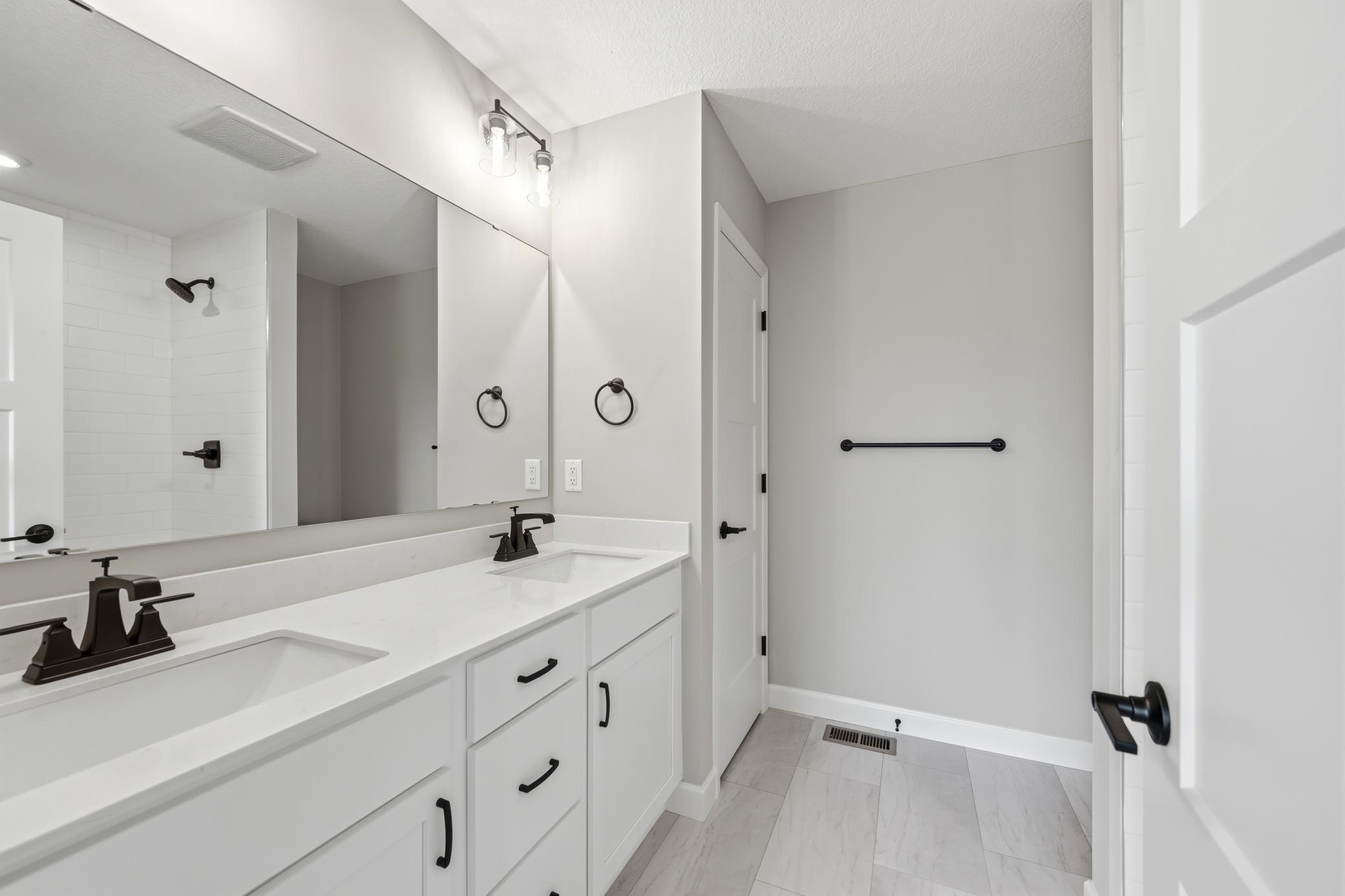 Primary suite - photos of a completed home of the same floorplan. Colors and selections may differ.