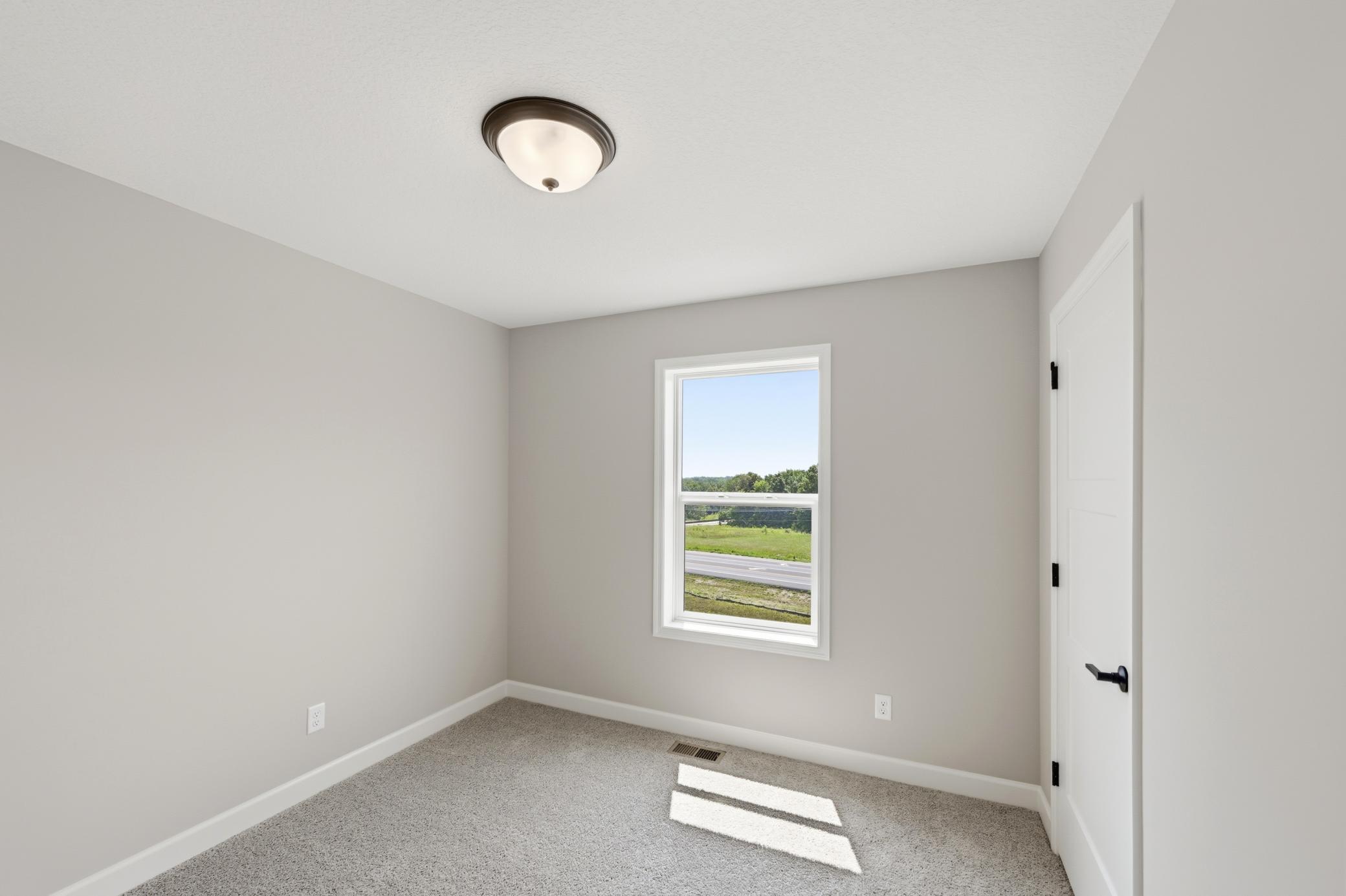 Bedroom - photos of a completed home of the same floorplan. Colors and selections may differ.