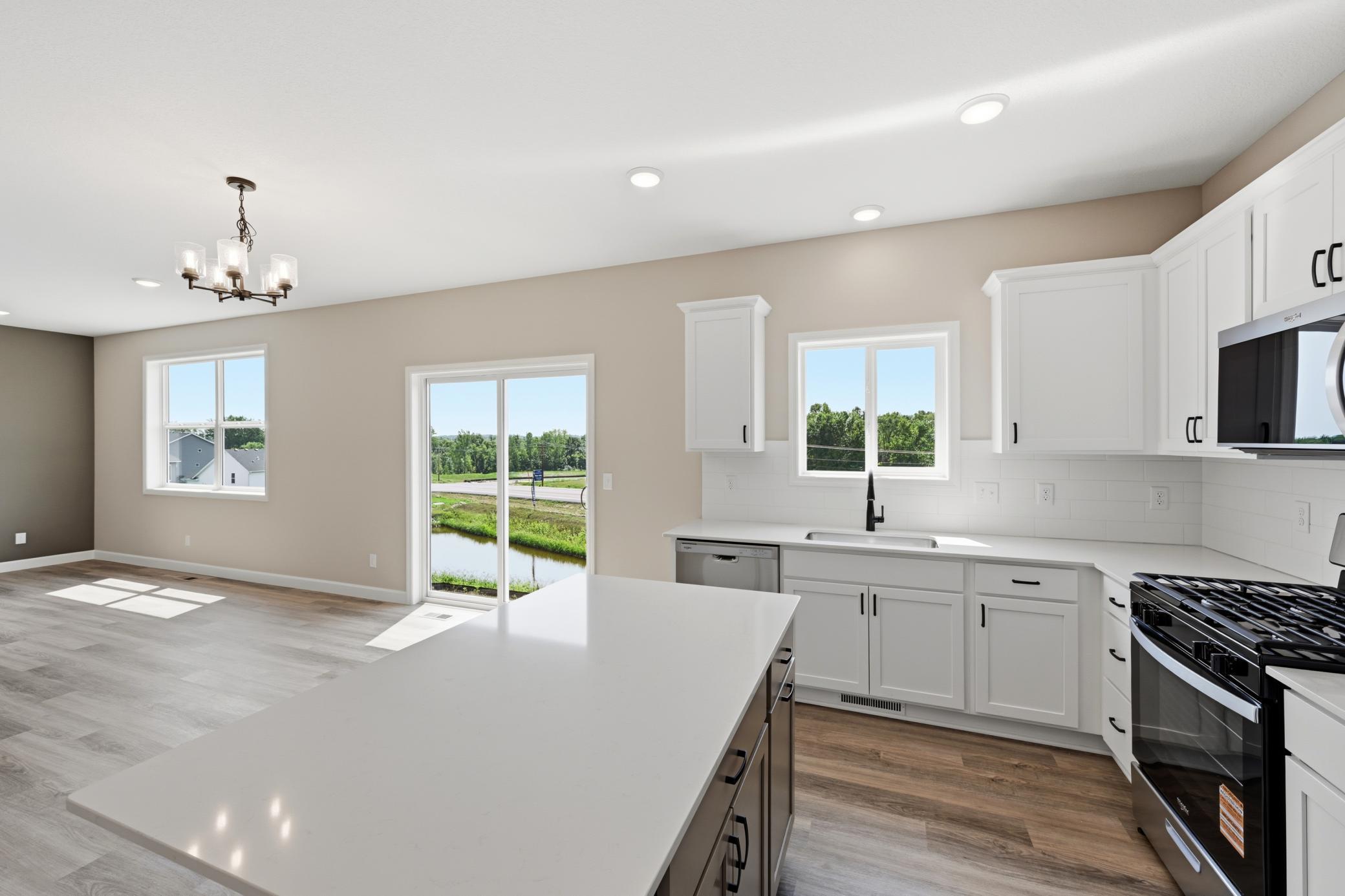 Kitchen - photos of a completed home of the same floorplan. Colors and selections may differ.