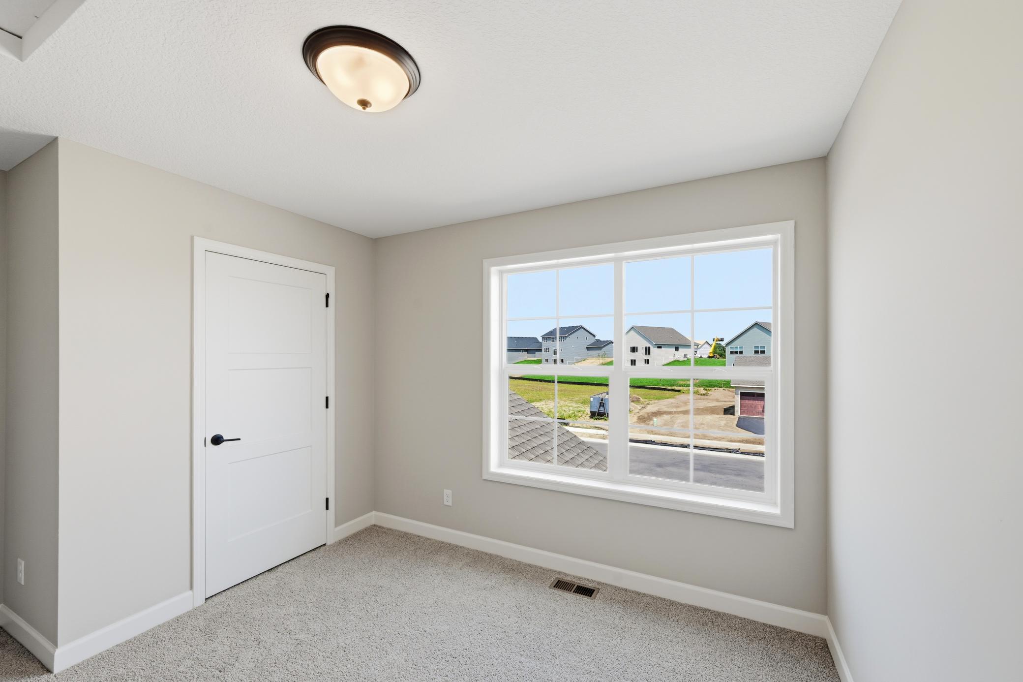 Bedroom - photos of a completed home of the same floorplan. Colors and selections may differ.