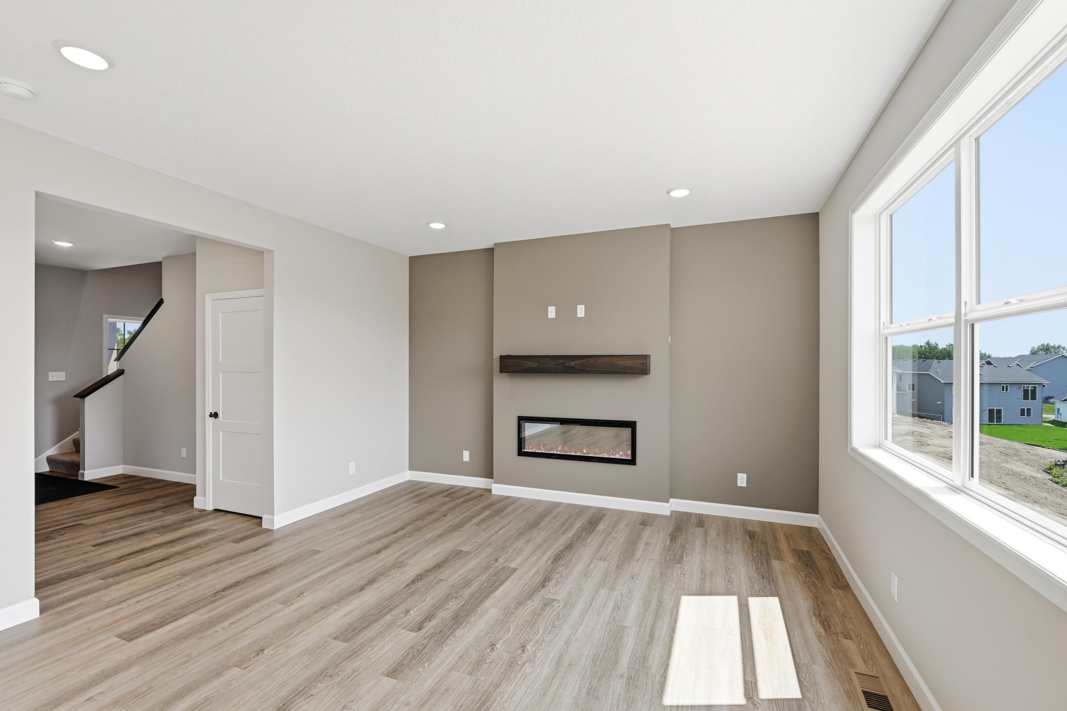Living room - photos of a completed home of the same floorplan. Colors and selections may differ.