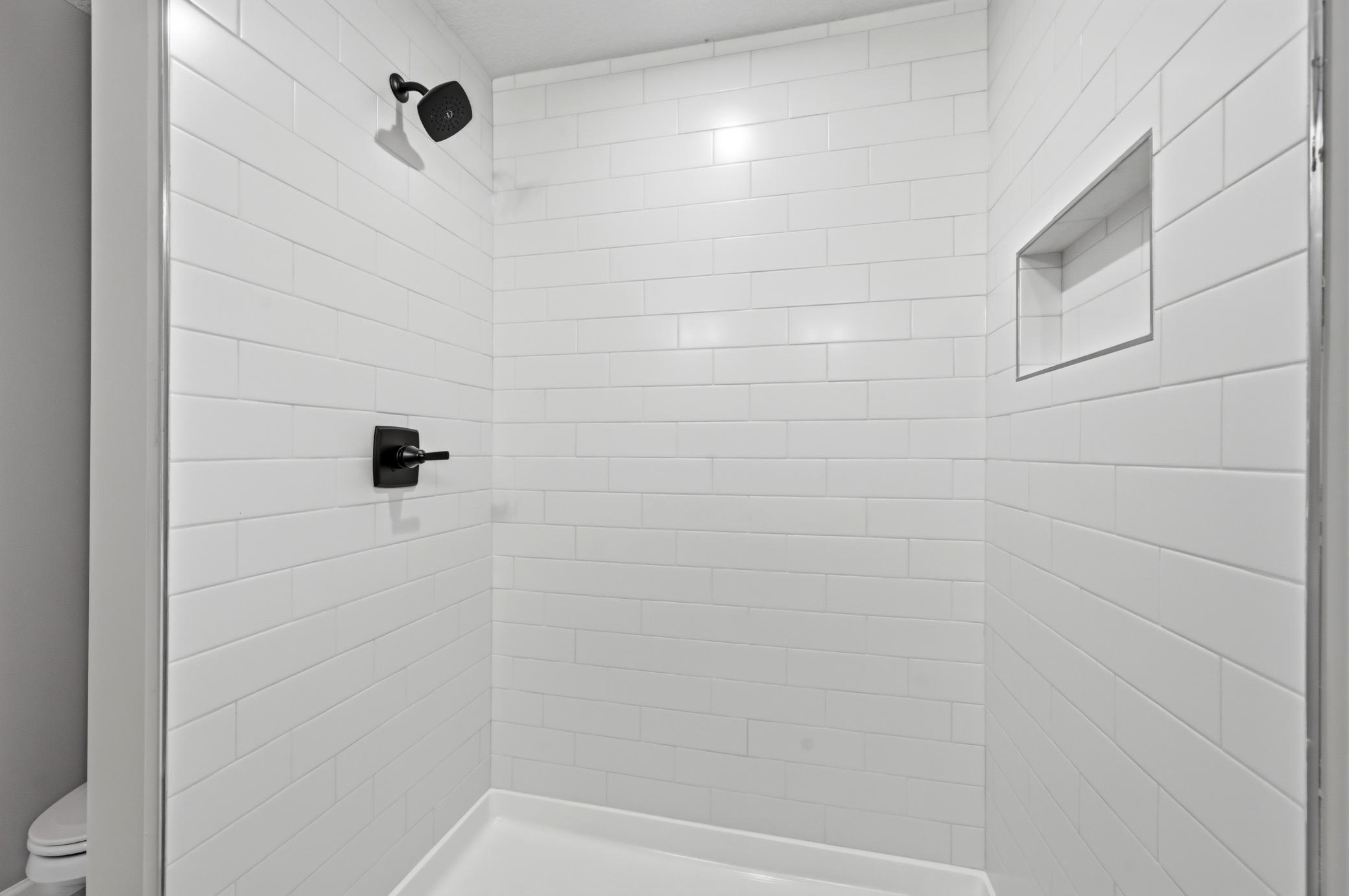 Primary suite luxury shower - photos of a completed home of the same floorplan. Colors and selections may differ.
