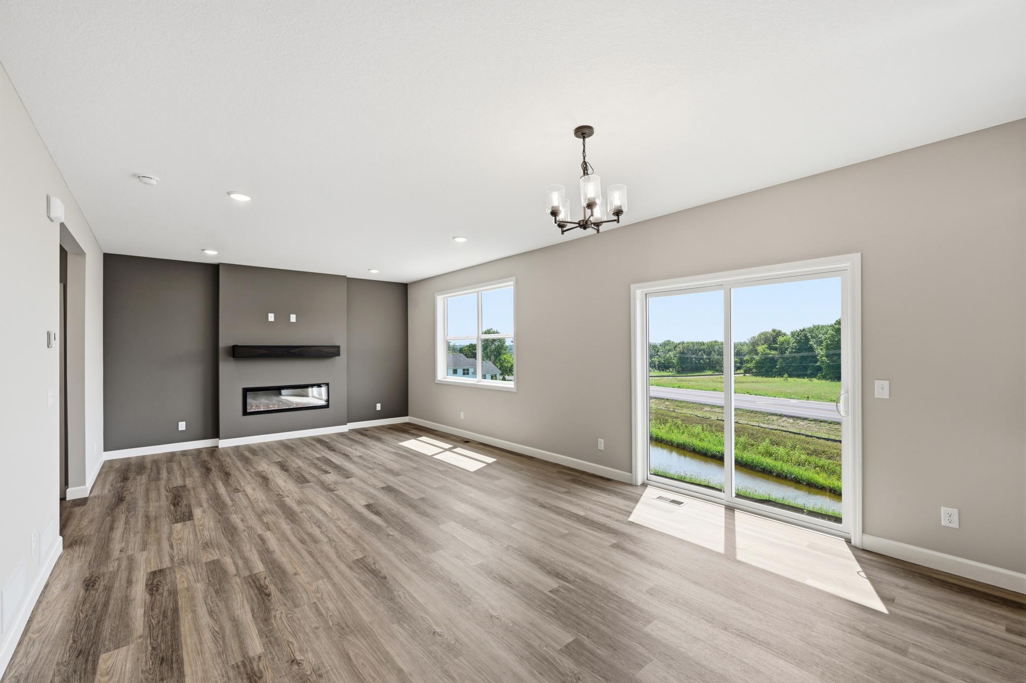 Living room - photos of a completed home of the same floorplan. Colors and selections may differ.