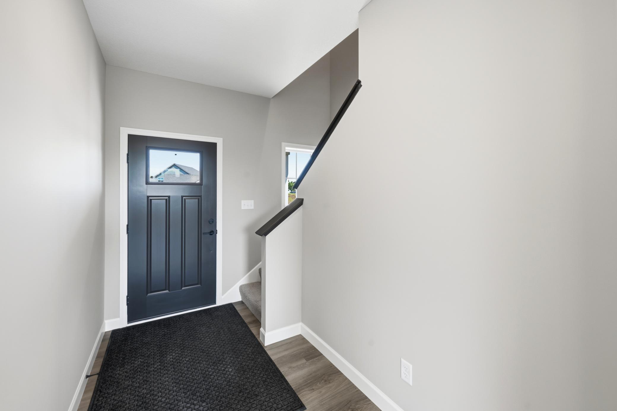 Entry - photos of a completed home of the same floorplan. Colors and selections may differ.
