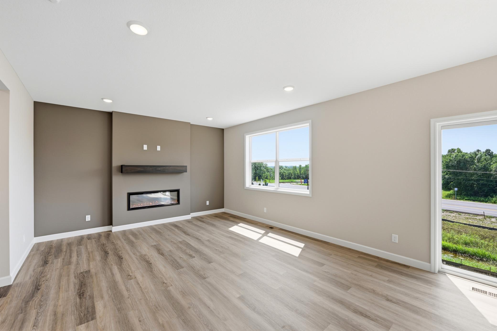 Living room - photos of a completed home of the same floorplan. Colors and selections may differ.