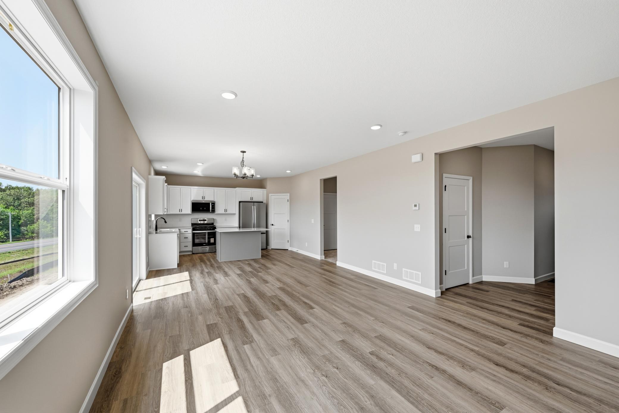 Living room - photos of a completed home of the same floorplan. Colors and selections may differ.
