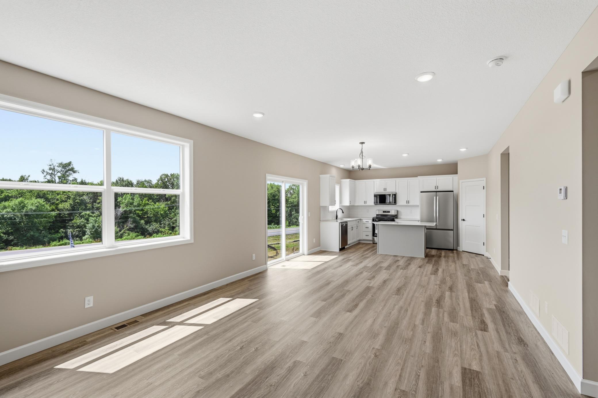 Living room - photos of a completed home of the same floorplan. Colors and selections may differ.