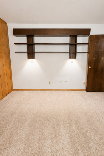 Primary bedroom built in headboard with accent lighting