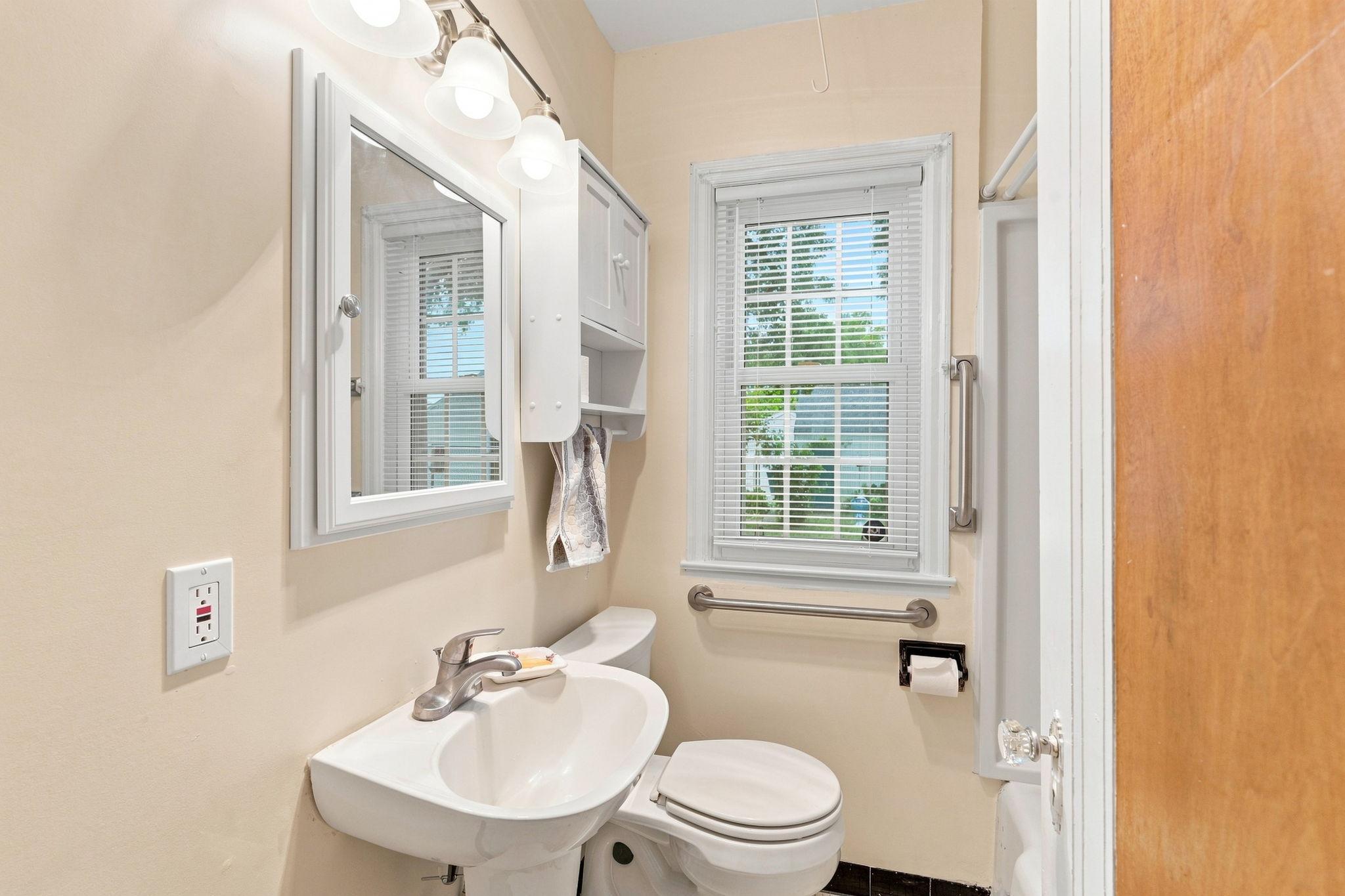 Bath was updated, but charming floor retained