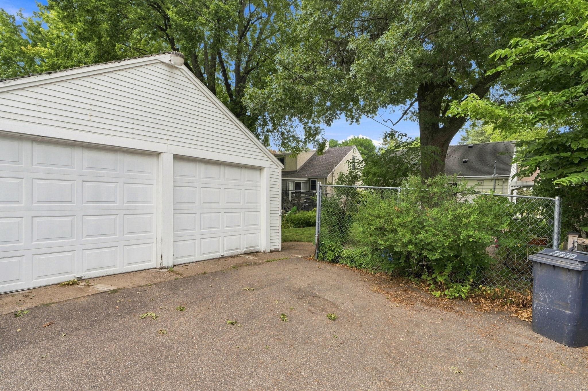 Spacious two car garage with newer garage doors