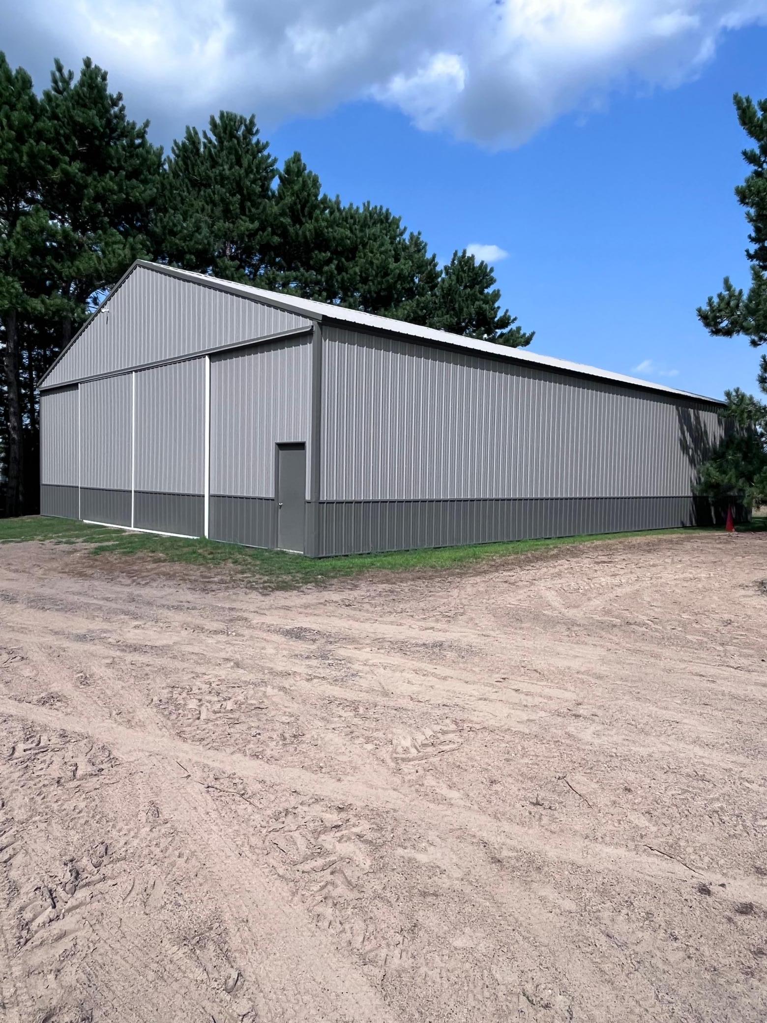 50' x 72' Storage shed with sand floor.