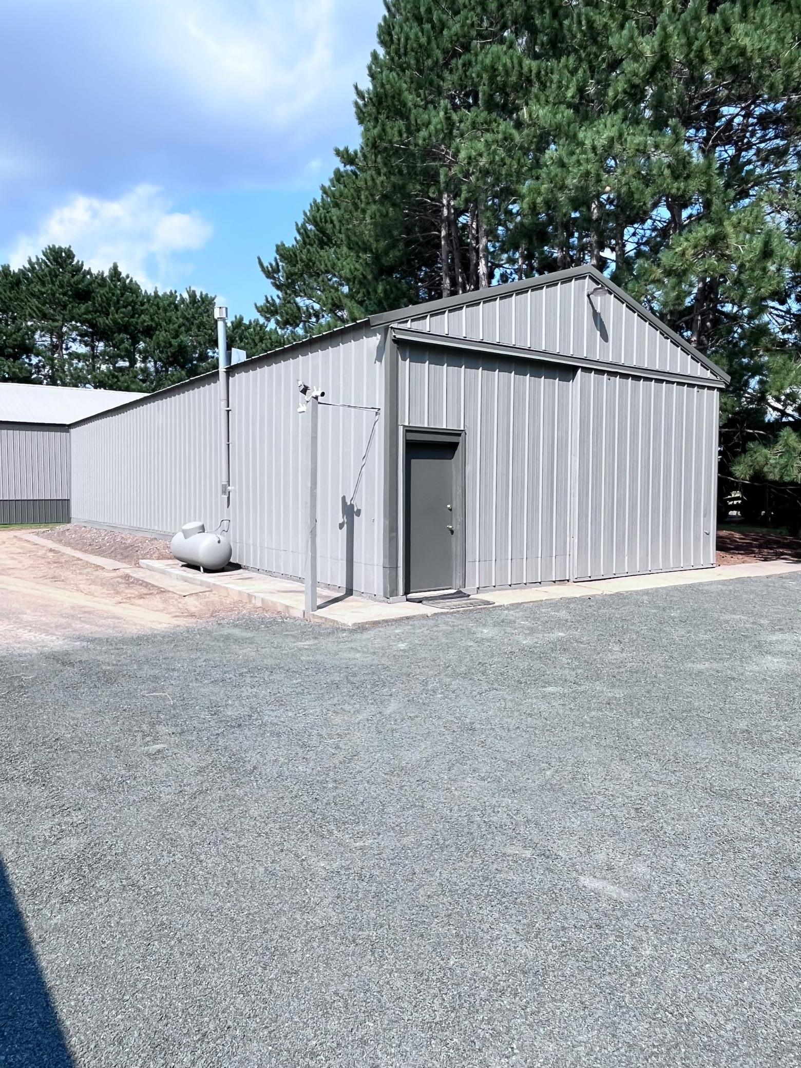 24' x 64' pole building. Front half is a heated workshop.