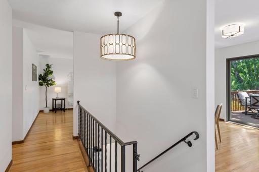 Hardwood floors and new lighting create a warm, inviting space