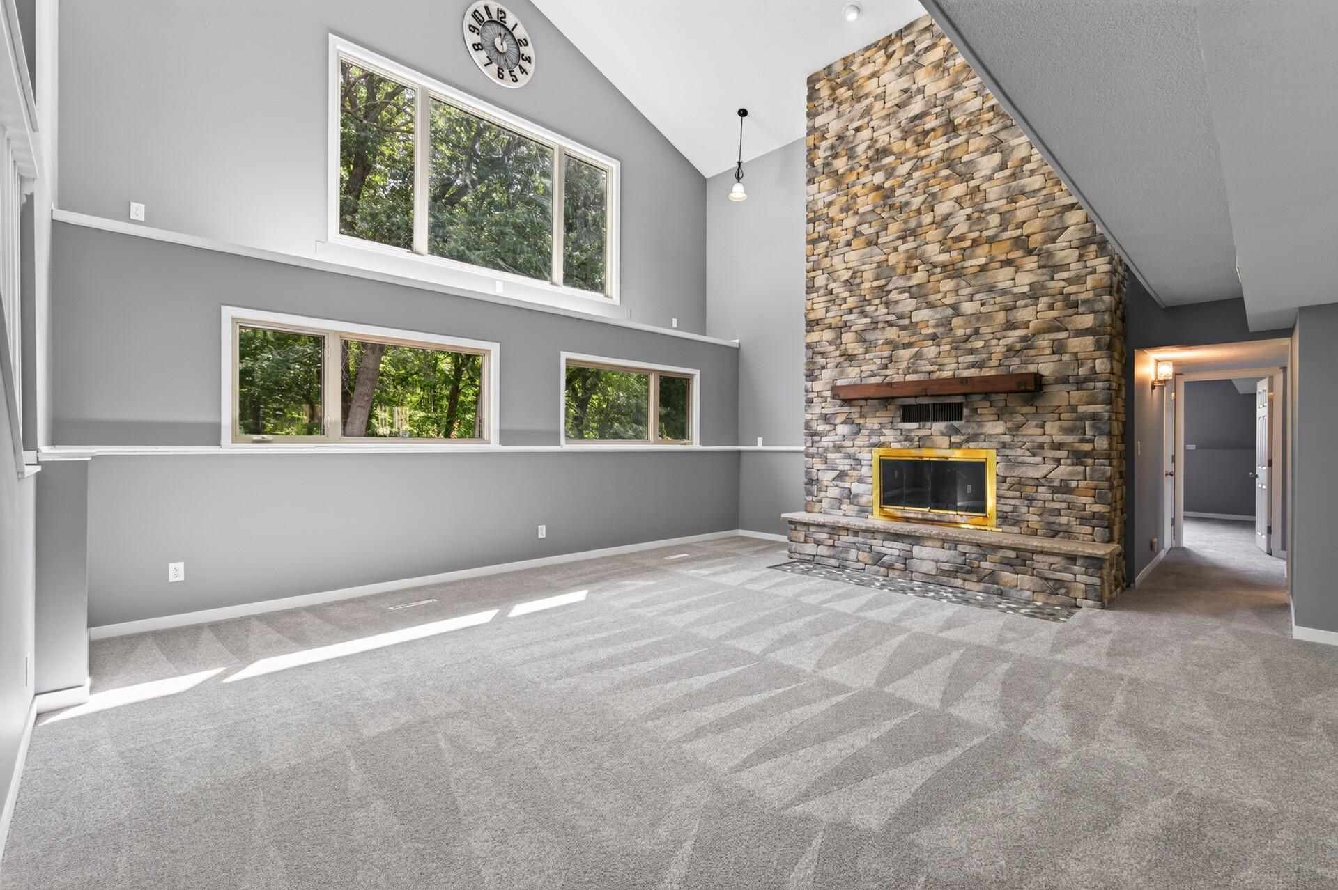 Stunning floor to ceiling stone fireplace.